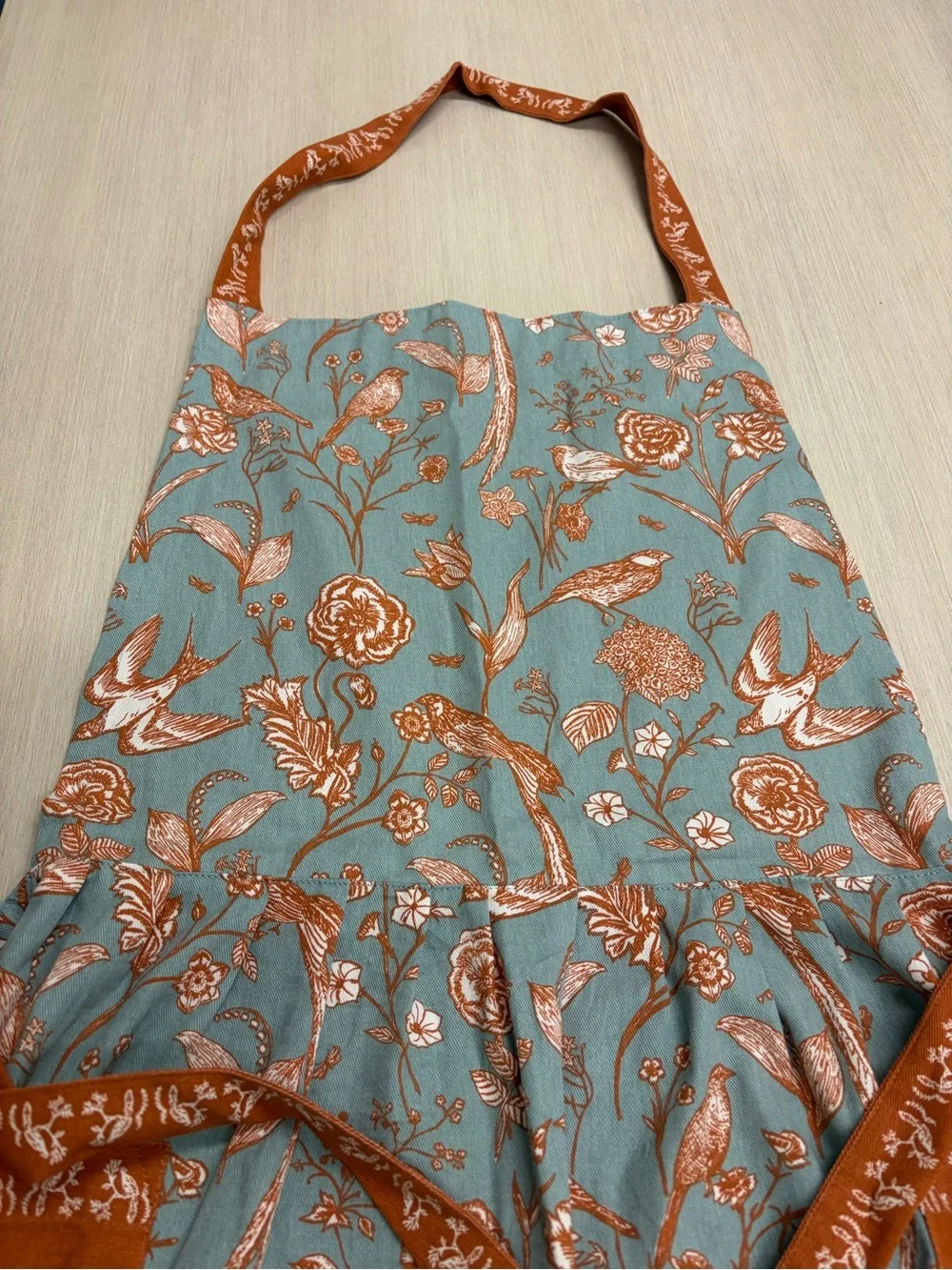 World Market Apron Light Blue and Orange Floral Bird Apron with Pockets - Picture 3 of 10